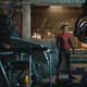 Tom Holland in his Spider-Man costume (without the mask) in a behind-the-scenes shot of No Way Home.